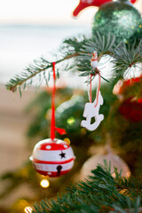 close up of Christmas tree ornaments on the tree 