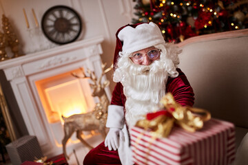 Happy Santa Claus brought gifts to children.  New year and Merry Christmas holidays concept