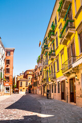 Sunny and beautiful Venice. Old colorful buildings, narrow streets and bridges. Monuments of Venice in Italy
