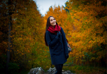 Naklejka na ściany i meble person in the autumn forest