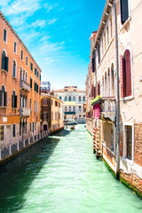 Obraz na płótnie Canvas Sunny Venice, Italy. Old colorful buildings, narrow streets and bridges. Monuments of Venice