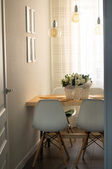 dinner table with a bouquet of flowers.