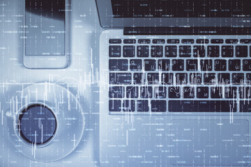 Stock market chart and top view computer on the table background. Multi exposure. Concept of financial analysis.