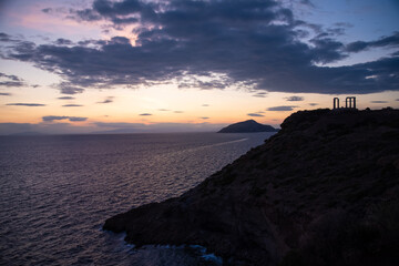 Greece Cape Sounio. Ruins of an ancient temple of Poseidon, Greek god of the sea, shot before sunset with sea view.
Tourist landmark of Attica, Sounion, Greece