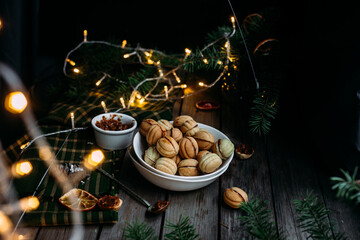 Fototapeta na wymiar Cookies Nuts with filling on a dark table