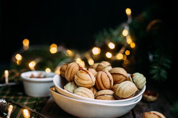 Cookies Nuts with filling on a dark table