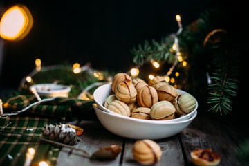 Cookies Nuts with filling on a dark table