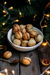 Cookies Nuts with filling on a dark table