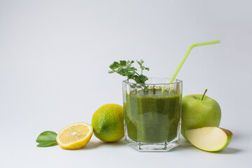 Detox cocktail from raw green fruits and vegetables and lettuce and parsley