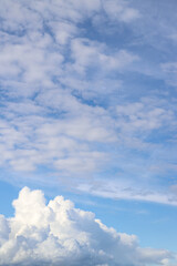 White thick clouds and blue sky background. Sunny day