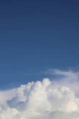 White thick clouds and blue sky background. Sunny day