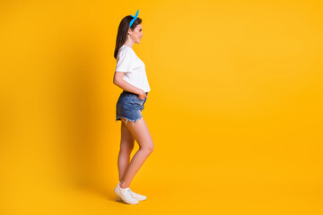 Fototapeta na wymiar Full length body size photo portrait of woman wearing headband casual outfit looking blank space isolated on bright yellow color background