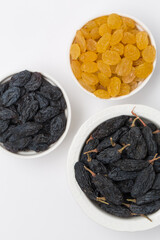 Dried fruits, raisins on white background