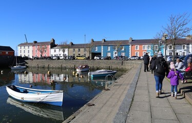 Fototapeta na wymiar Colourful houses and buildings beside the pretty harbour at Aberaeron, Ceredigion, Wales, UK.
