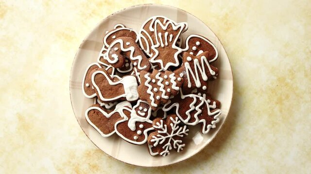 Gingerbread cookies in various Christmas theme shapes on plate