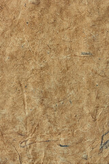 Textured brown wrinkled handmade paper background. Vertical background for design