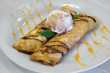 pancakes with ice cream are on the plate