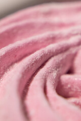 Abstract macro lines meringue. Colored sweet pink dessert zephyr or marshmallows in pastel colors. close-up, selective focus.