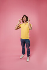 Joyful handsome caucasian guy laughing and looking upward