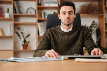 Entrepreneur working with a laptop and documents