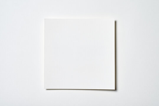 Premium Photo  A square white piece of plain paper on white background