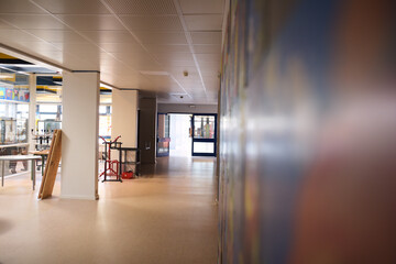 empty school hallway with art on wall