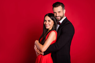 Profile photo of optimistic couple wear vivid dress black suit isolated on red color background