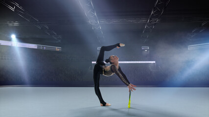 Fototapeta na wymiar Rhythmic gymnast in professional arena.