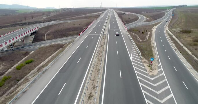 Aerial view over Highway and overpass. Road junction. Transportation and infrastructure development