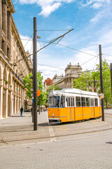 Yellow tram in Budapest - Public transport in Hungary. Old streets of capital city