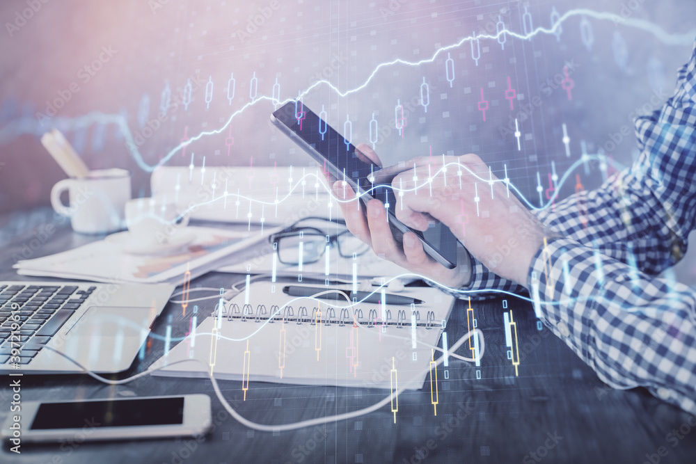 Poster double exposure of man's hands holding and using a digital device and forex graph drawing. financial