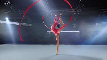 Rhythmic gymnast in professional arena.