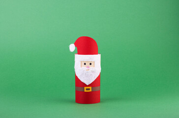 paper Christmas crafts for children on a green background