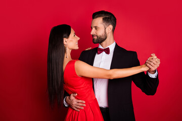Profile photo of nice couple dance wear suit dress isolated on red color background