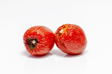 rotten tomatoes isolated on white. Moldy and spoiled tomato. vegetable with a disease