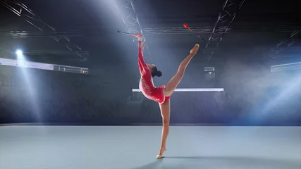 Zelfklevend Fotobehang Rhythmic gymnast in professional arena. © VIAR PRO studio