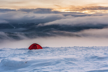 Rest in a tent on a mountain ridge with wonderful landscapes around.	