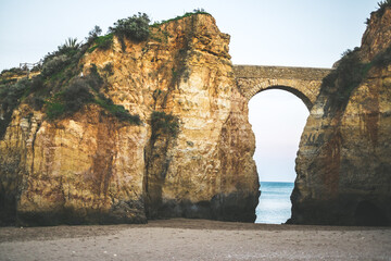 Lagos beaches, bridge over cliffs, Algarve coast, Portugal.