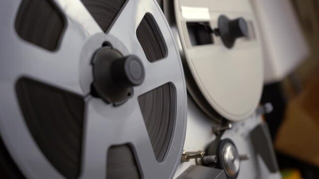 Hand held pullback of a reel to reel tape player