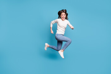 Fototapeta na wymiar Full length photo of impressed wavy lady wear white sweater jumping running isolated blue color background