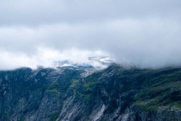 Norwegian landscape. Beautiful fjords. Cloudy and rainy day. Lakes and mountains