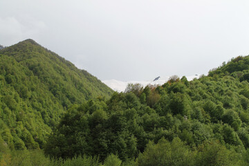 landscape with clouds on the way to the top of Kazbegi