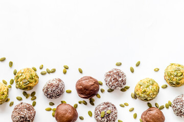 Top view of raw vegan energy balls with nuts and cacao