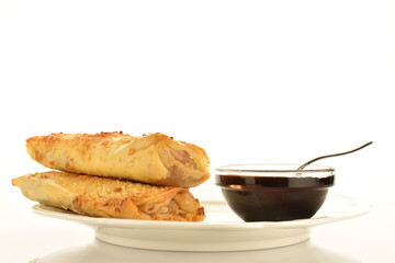 Homemade apple mini strudel, close-up isolated on white.