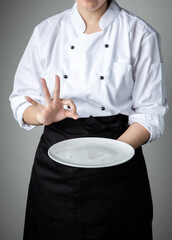 chef present food with white empty plate