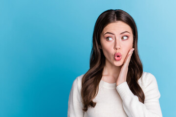 Photo of impressed charming wavy lady wear white sweater arm cheek isolated blue color background