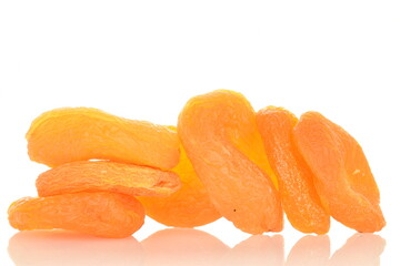 Bright orange natural dried apricots, close-up, isolated on white.