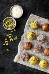 Homemade raw chocolate balls - vegan truffles with cacao and coconut