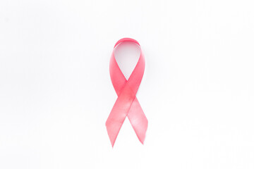 Pink ribbon breast cancer awareness isolated on white. Top view