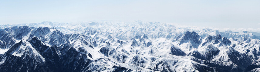 Fototapeta na wymiar snow covered mountains from the top of Kazbegi